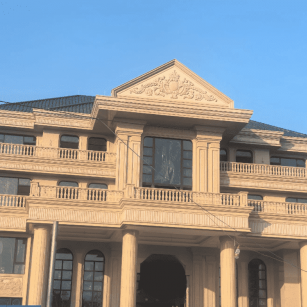 云浮黄金麻别墅外墙干挂石材效果示例